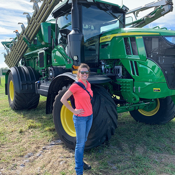 Student and John Deere tractor
